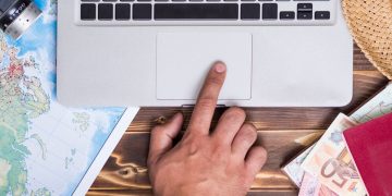 hand-touching-touch-pad-laptop_23-2148256051
